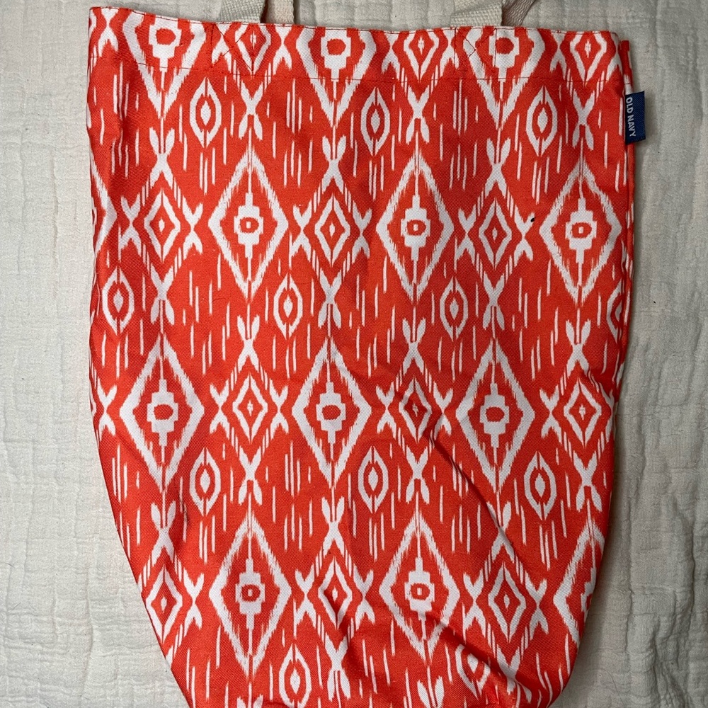 Old Navy light orange beach bag with white details.